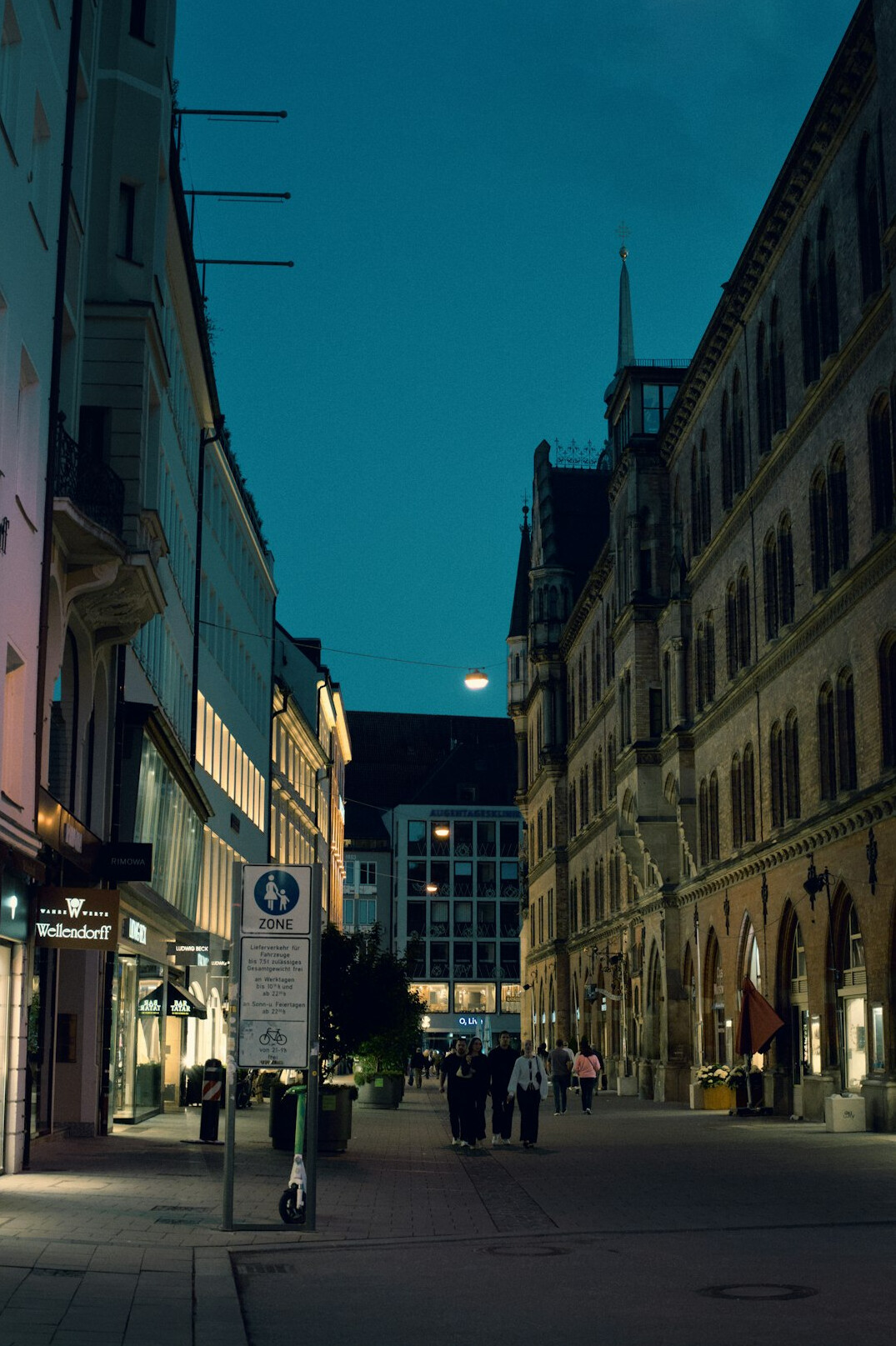 Empty city street at night under moonlight