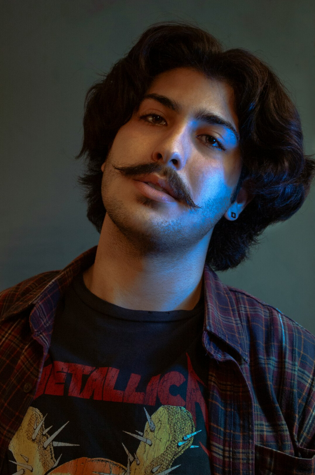 Portrait of a Latino man fact-checker in a shirt